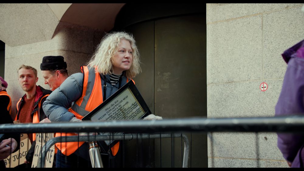 Cathy Eastburn with a placard
