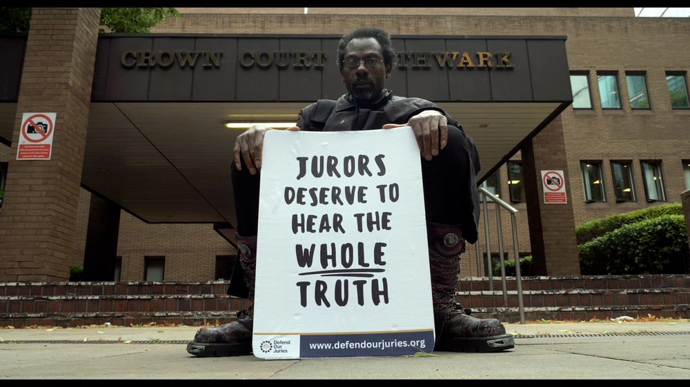 Clive Dolphin with a jury-rights sign